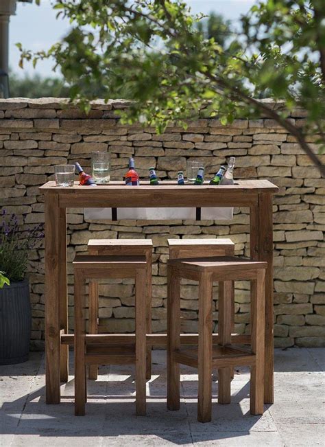 A bistro table and chairs provide the perfect setting for a twosome to enjoy a relaxed meal or watch the sunset. Reclaimed Teak Bar Table and 4 Stool Set | Diy patio table, Outdoor tables and chairs, Outdoor ...