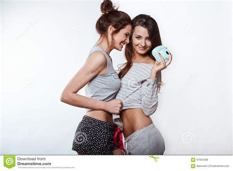 Studio Lifestyle Portrait Of Two Best Friends Hipster Crazy Girls Stock