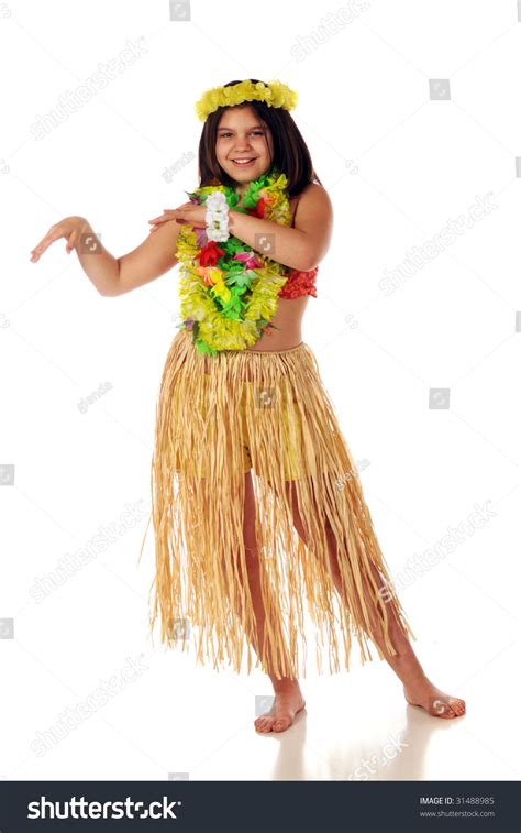 A Preteen Girl In Hawaiian Leis And A Grass Skirt Preparing To Dance
