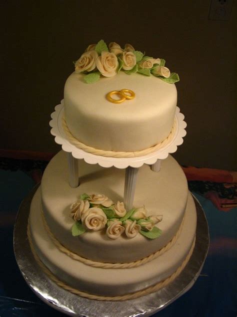 ivory wedding cake with roses