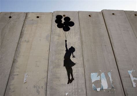 A Graffiti Titled Balloon Debate Made By Banksy Is Seen On Israel S