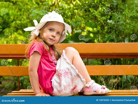 Little Girl Sitting On The Bench Stock Photography Image 19874202