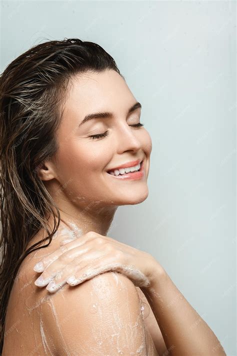 Premium Photo Sensual Woman Washing Her Body With Shower Gel