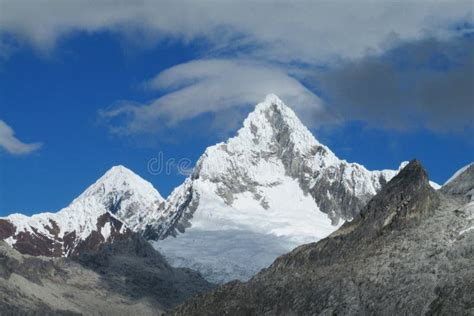 Rocky And Snow Ice Covered Mountain Range Of Cordillera Blanca In The