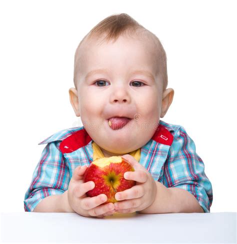 Little Child is Eating Red Apple Stock Image - Image of cute, closeup ...