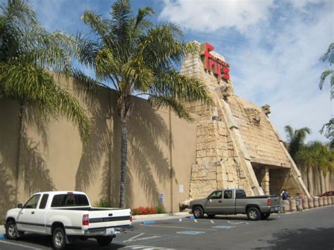 The store exterior resembles a blocky ancient world temple. Fry's Electronics - San Jose, California | store / shop