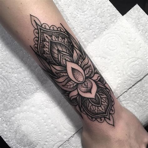 This is a cute dragonfly tattoo on the wrist. Image result for lotus cuff tattoo design | Cuff tattoo ...