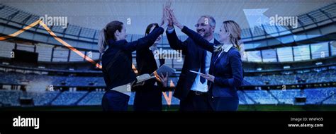 Composite Image Of Happy Business People Giving High Five Against White
