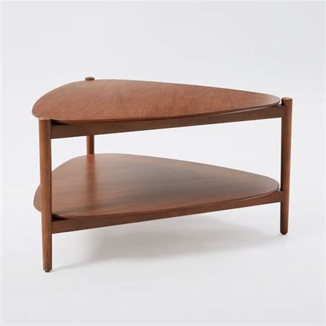 Create the ultimate conversational atmosphere with a round dining room table that invites chatter from the get go. Retro Tripod Coffee Table | West Elm