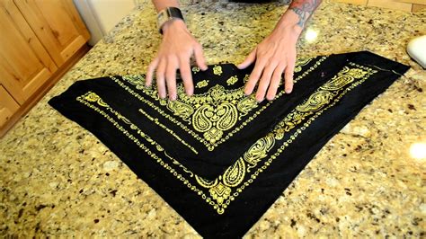 Well, fold along the bias line and cut a straight line with your scissors. How to fold a bandana - YouTube