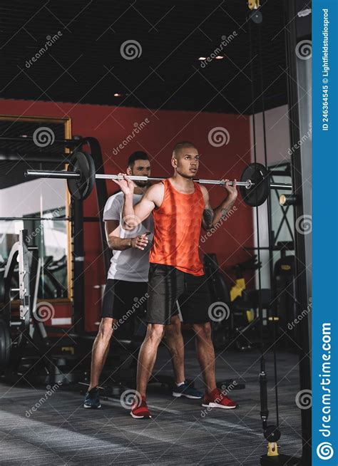 Attentive Trainer Controlling African American Sportsman Stock Image