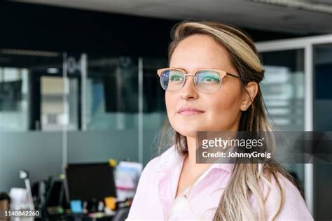 candid portrait of latin american business woman at work photos and premium high res pictures