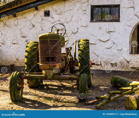 Old Rusty Vintage Tractor On The Farm Retro Farmers Equipment And
