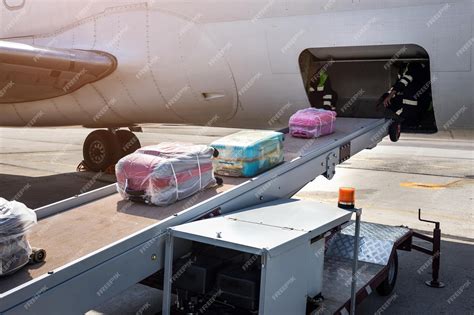 Premium Photo Loading Luggage On The Plane The Baggage On The