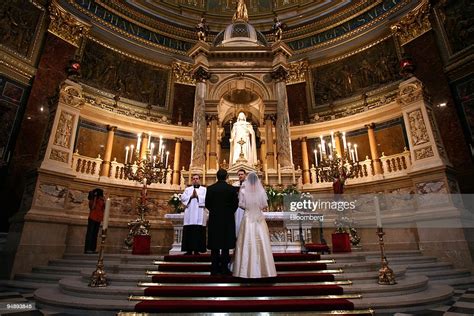 A Hungarian Couple Listens To The Priest During Their Wedding News