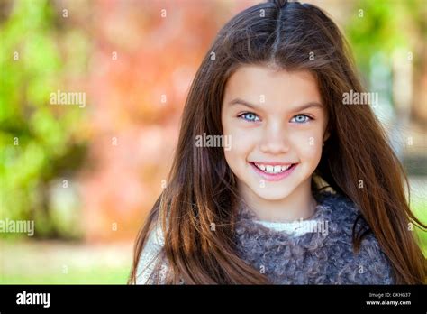 Close Up Portrait Of A Beautiful Nine Year Old Little Girl In Autumn