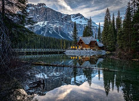 Magnificent Scenery Of Emerald Lake With Bridge Over Water And Wooden