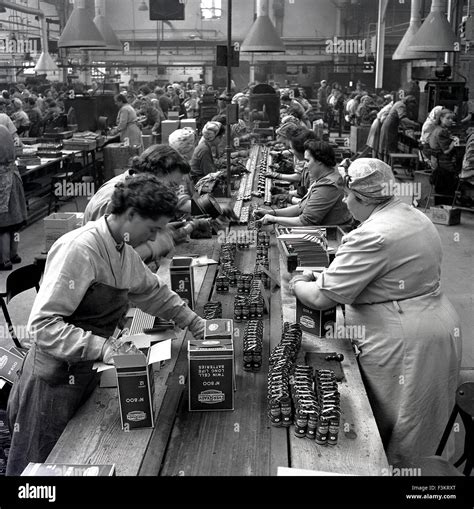 Historical 1950s Female Operatives Working On The Factory Floor At