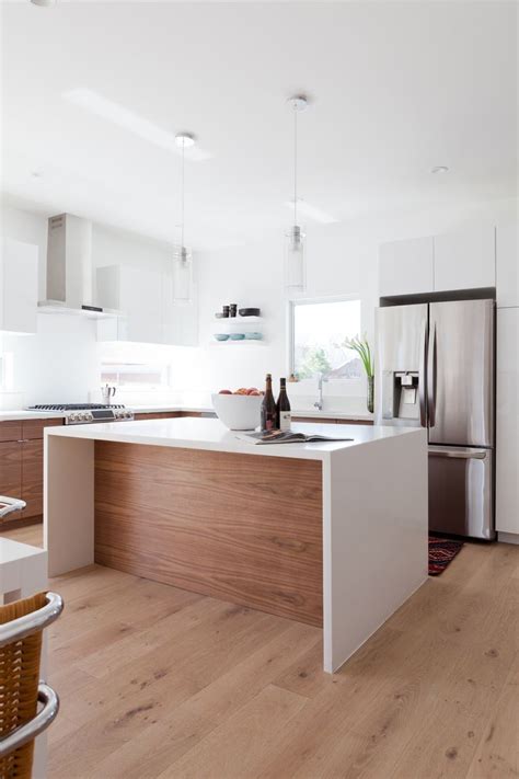 Granite countertops shall make fine completion with color contrast. Veneer Designs, waterfall edge island, modern kitchen ...