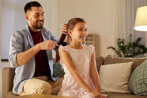 Father Brushing Daughter Hair At Home Stock Image Image Of Leisure
