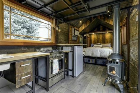 It was designed and built by damon wake and hunter floyd, an this teensy little house called the nugget by modern tiny living is a cozy cocoon built for comfort. This 74K tiny home has an incredible interior that's ...