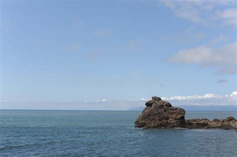 Picturesque Seashore With Rocks And Beach On A Sunny Day With Clear