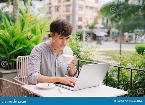 Young Male Freelancer Working With Laptop Computer In Comfortable