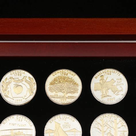 Collection Of Fifty Six Gold And Silver Highlighted Statehood Quarters