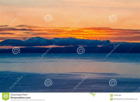 Beautiful Orange Sunset Over The Lake With Mountain Stock Photo Image