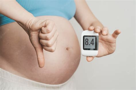 Premium Photo Gestational Diabetes In Pregnancy Pregnant Woman Check Sugar Level With A
