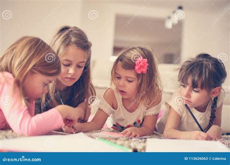 Four Girls Lying On The Floor Stock Image Image Of Cheerful Close