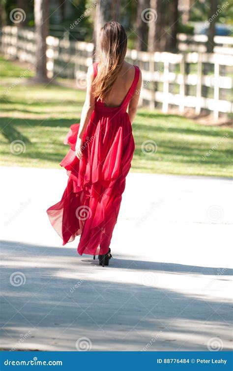 Woman In A Red Dress Walking Away Stock Photo Image Of Women Fashion