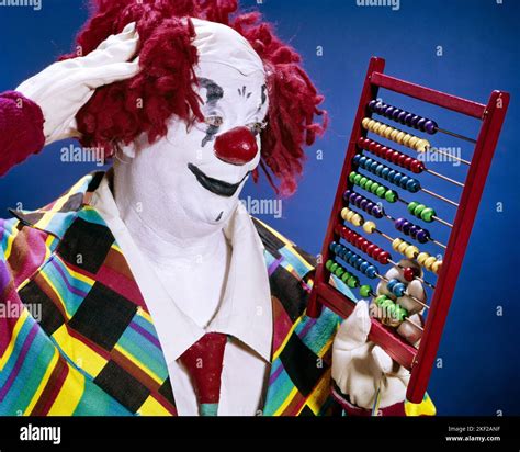 1960s Whiteface Clown In Red Mop Yarn Wig Red Nose Scratching His Head Trying To Figure Numbers