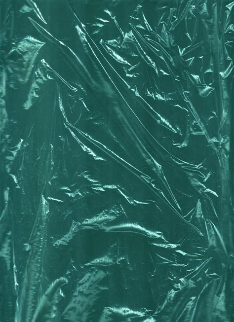 An Image Of Shiny Green Material That Looks Like It Has Been Wrapped In