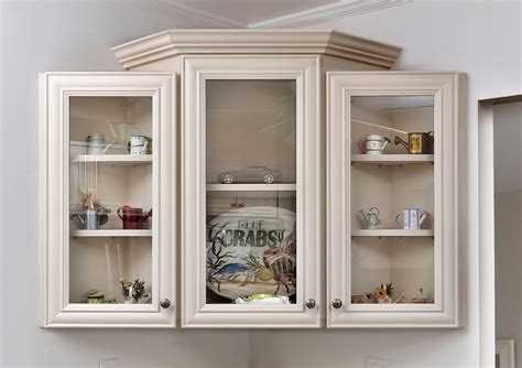 Cabinet refacing replaces the veneer on the visible surfaces of the cabinet while leaving the structural aspects intact. This kitchen in Essex, MD was refaced with recessed-panel ...