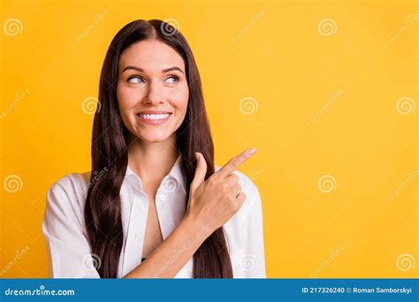 Photo Of Cheerful Pretty Girl Look Indicate Finger Empty Space Toothy