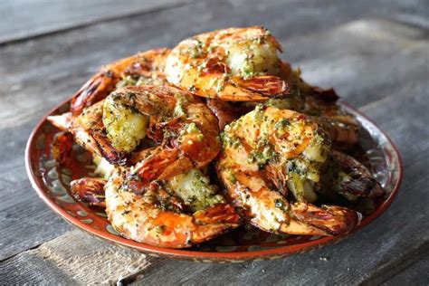 A Plate Full Of Cooked Shrimp And Broccoli