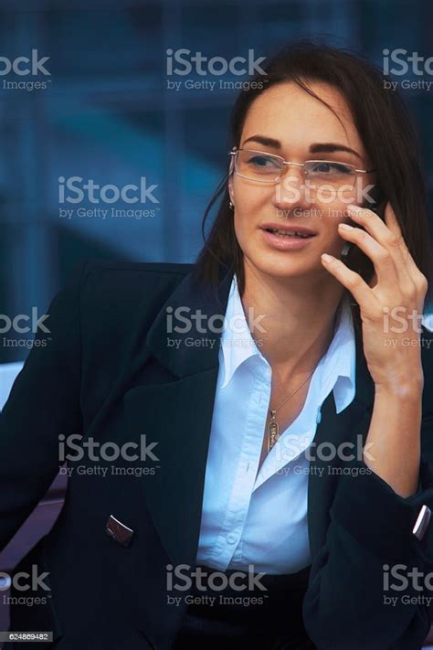 Beautiful Young Business Woman Smiling During A Phone Call Stock Photo