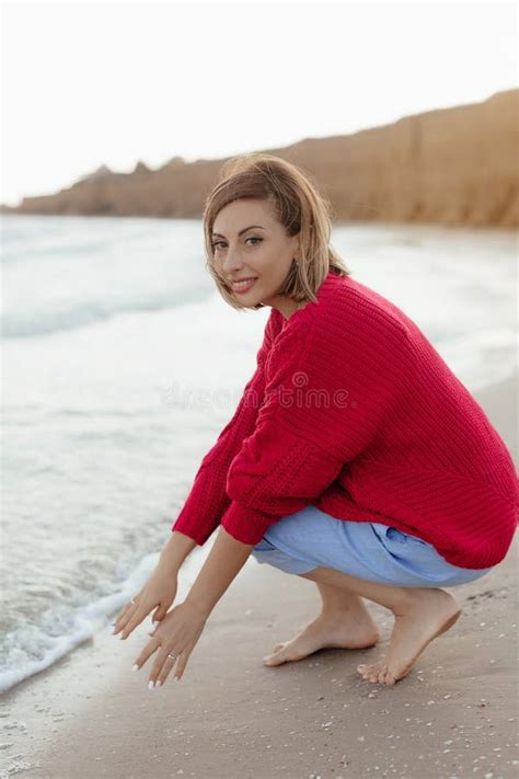 Happy Mature Woman Feeling The Breeze At Beach Beautiful Middle Aged Woman On Beach Copy Space