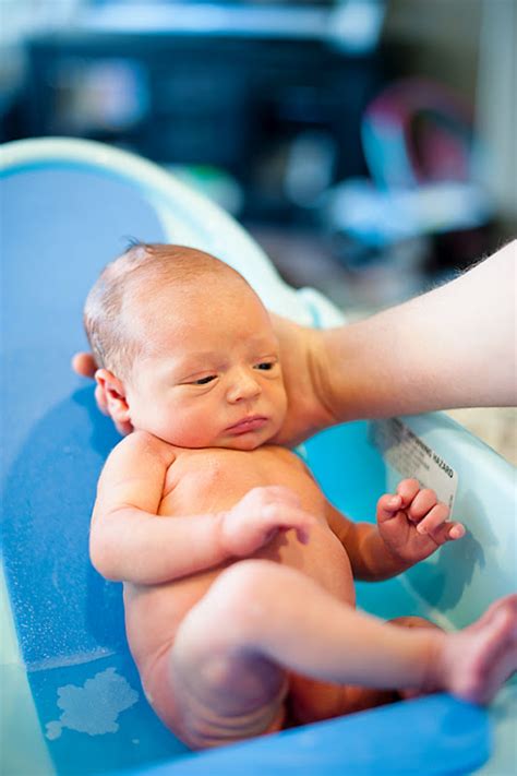 When your baby is ready to go in the tub, it's fine to use just water. Keeping up with the Evans: Baby's First Bath