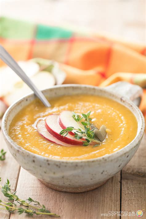 This easy acorn squash soup recipe is made with roasted acorn squash, carrots, celery, and cauliflower and blended with fresh garlic, ginger, and a touch of ground cinnamon for a cozy and delicious soup perfect for cold weather. EASY BUTTERNUT SQUASH APPLE SOUP | Cooking on the Front Burner