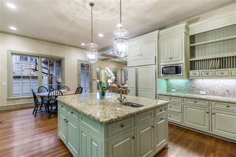 This kitchen layout typically involves one main wall of cabinets and sink or range perpendicular and adjacent to another, shorter wall. Kitchen Cabinet Colors Photos Designs Ideas & Layouts