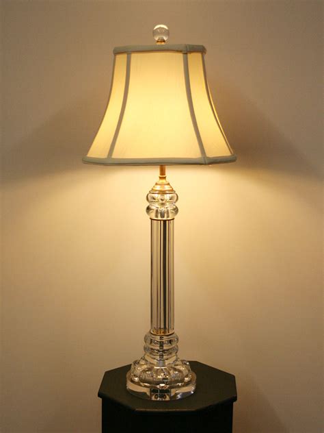 This small standing lamp brings interesting contrast with the metal and clear acrylic base, while the simple white shade keeps things versatile enough to pair with any of your existing styles. Vintage Clear Glass Pillar Table Lamp w/ Acrylic Base, c. 1960