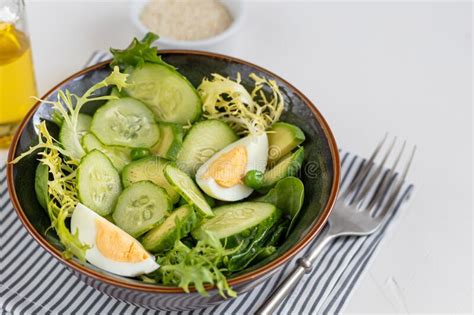 Salad Of Fresh Cucumbers Spinach Leaves Arugula Avocado Served With