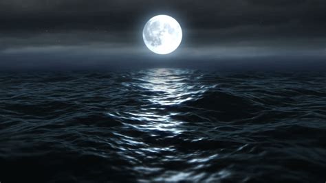 Flying Over Moonlit Ocean At Night Camera Tracks Slowly Over Dark