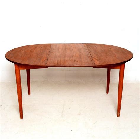The chairs will stack for convenient storage in limited spaces. Danish Modern Teak Round Oval Dining Table at 1stdibs