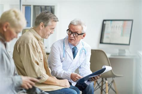 Senior Doctor Answering Patients Questions Stock Image Image Of