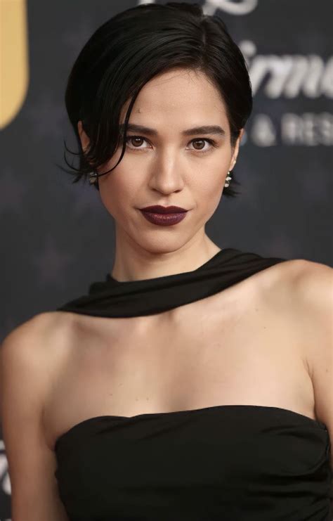 An Image Of A Woman With Dark Lipstick On Her Face And Black Dress At