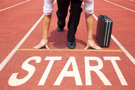 Businessman Getting Ready For Race On The Track Stock Photo Image