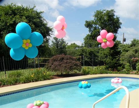 Tropical floral arrangements, heart shaped floral wreaths, and floating candles or lanterns are all popular choices that can add something. oh hey pool balloon decorations! Love these floating ...